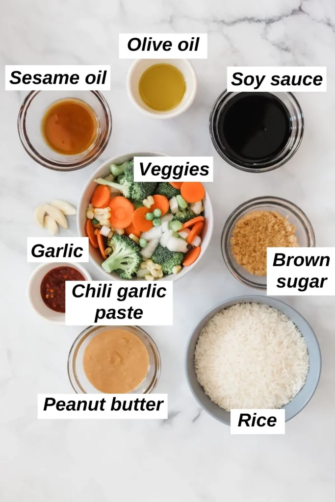 individual ingredients for vegan fried rice recipe in bowls on a white marble background