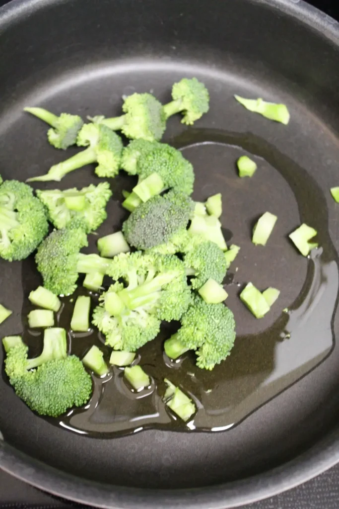 the first step to making pad see ew is sautéing the cut up broccoli in olive oil.