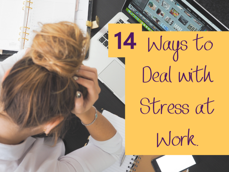 girl with messy bun holding her head due to stress at computer work