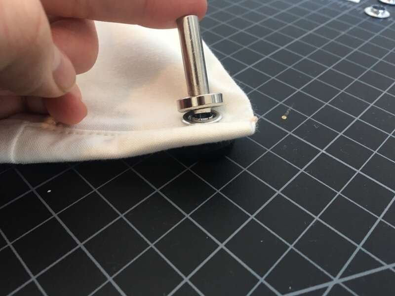 attaching metal grommets