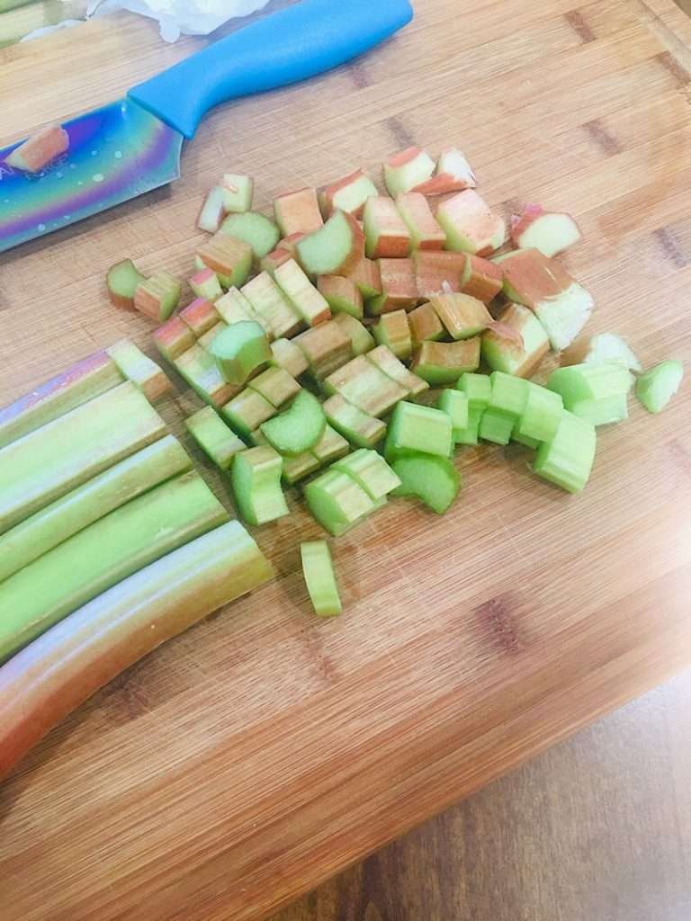 Chopping Rhubarb on a cutting board
