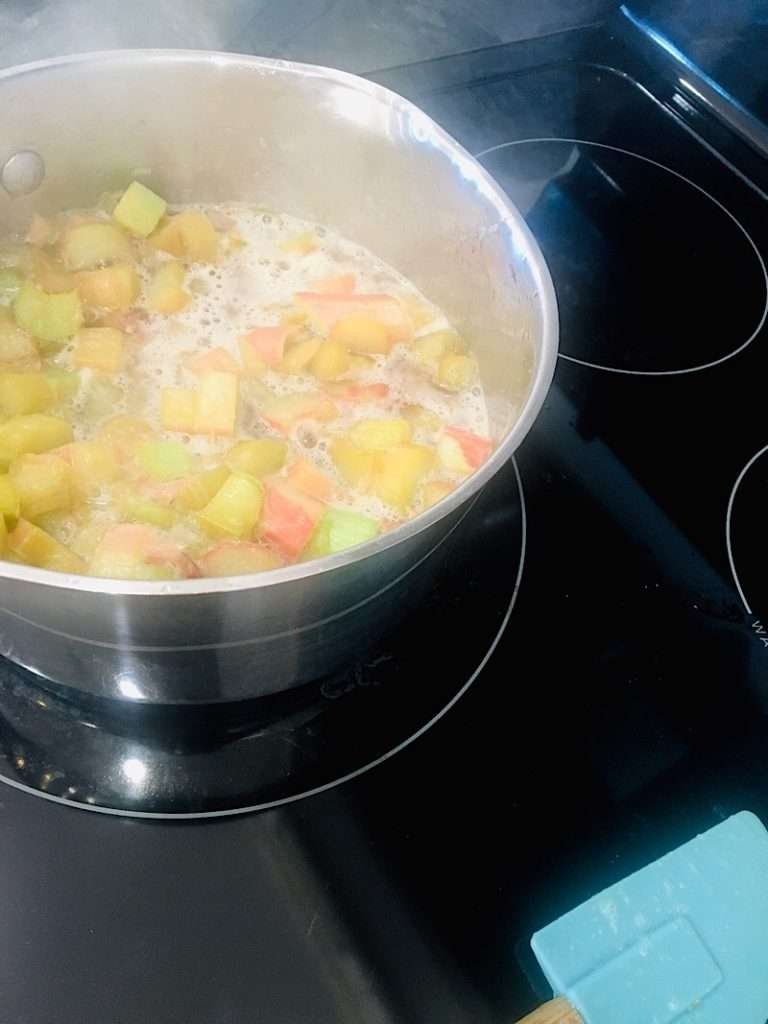 Boiling a pot of rhubarb sauce