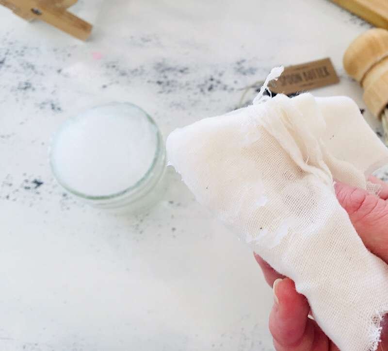 cheesecloth with cutting board cream on it