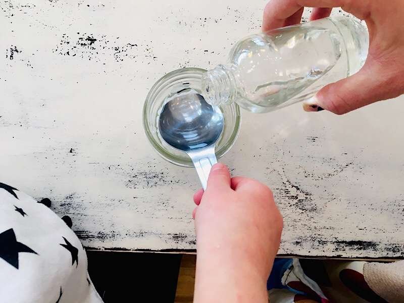 toddler helping mother measure ingredients for spoon butter
