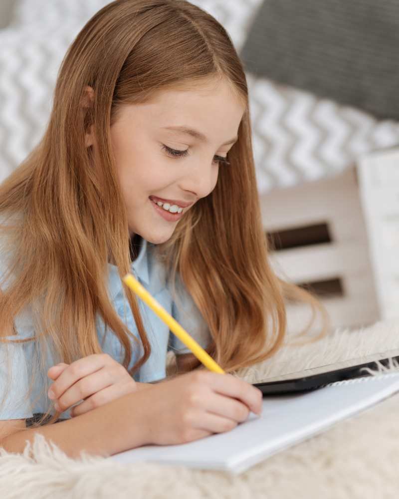 girl writing in notebook